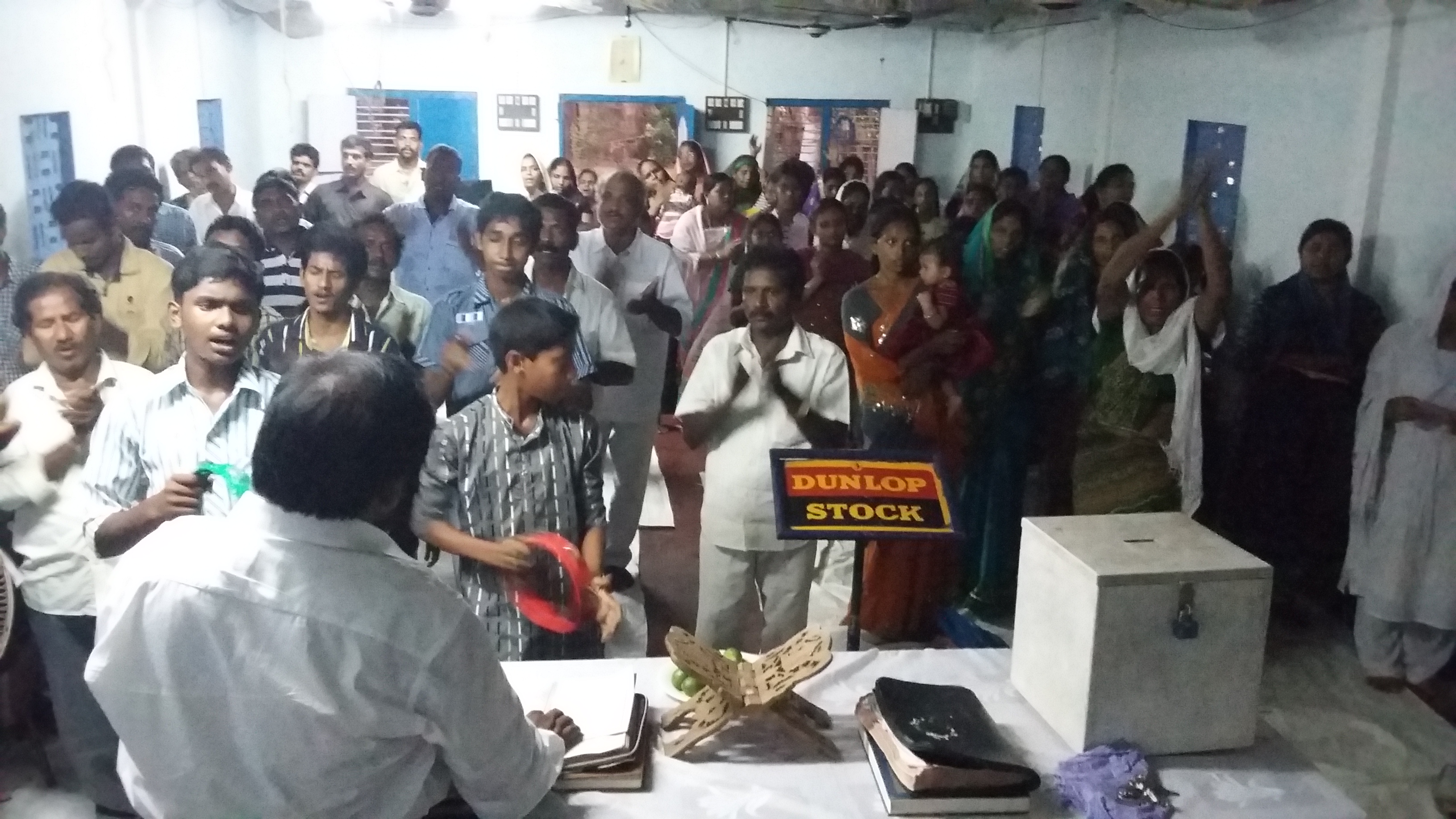 Believers gathered for prayer inside the assembly