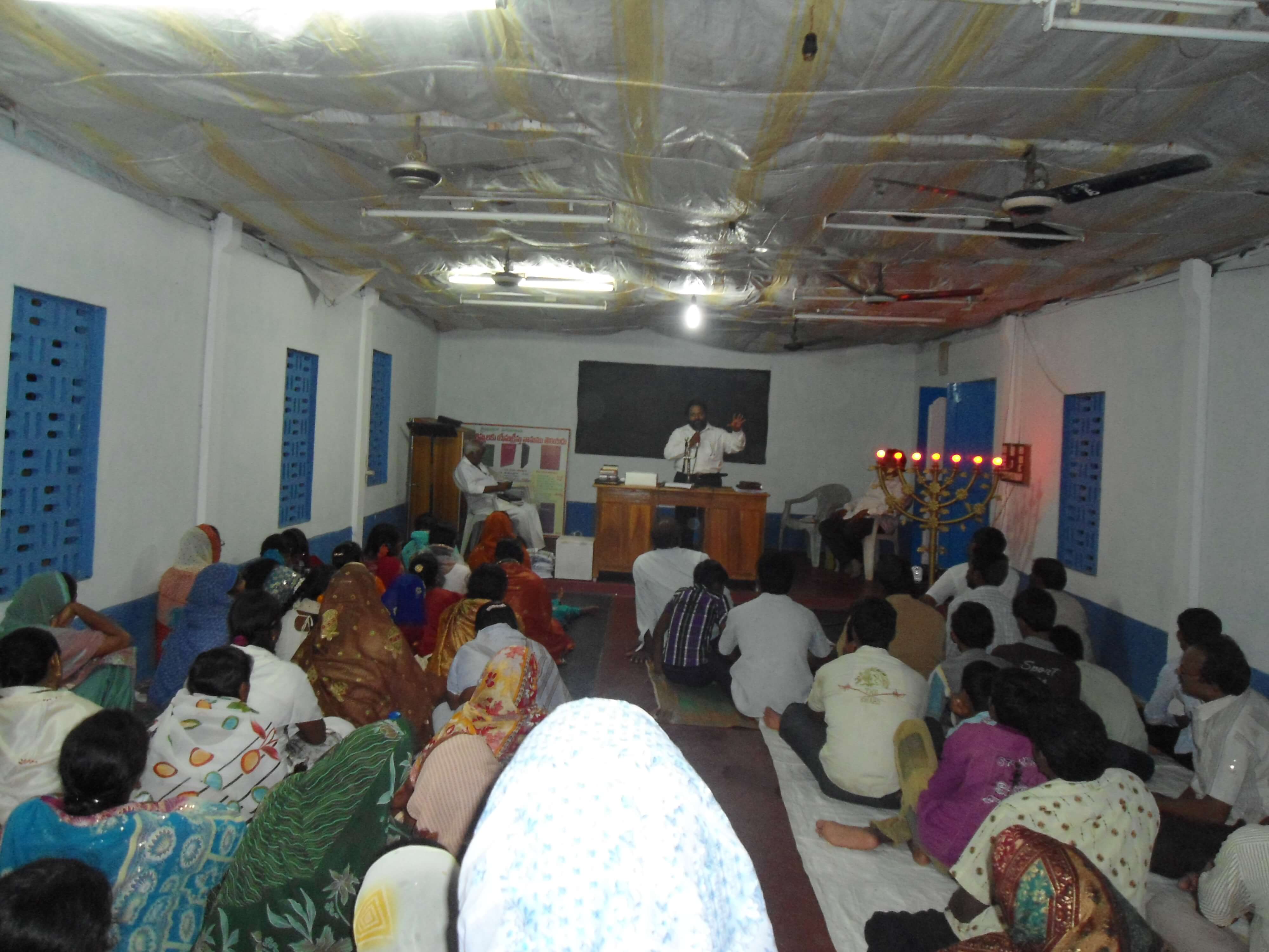 Brother Isaac preaching in the assembly hall